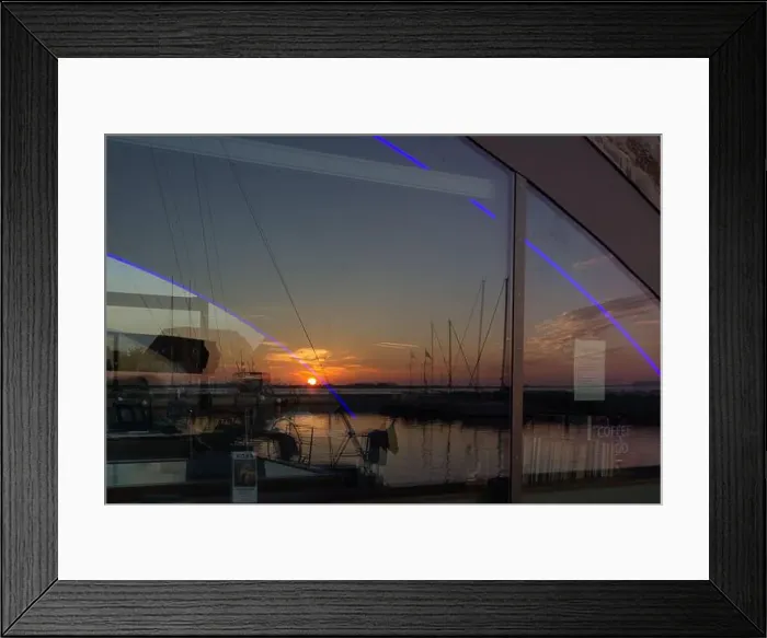 Framed Print : Reflections of a vibrant sunset over the marina in Wiek auf Rügen Framed Print : Reflections of a vibrant sunset over the marina in Wiek auf Rügen