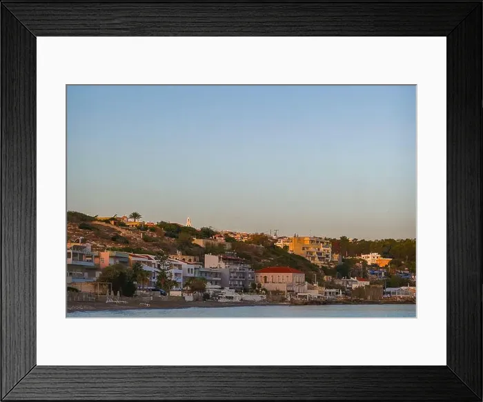 Framed Print : A peaceful coastal neighborhood at dusk with buildings nestled along the hillside and overlooking the sea Framed Print : A peaceful coastal neighborhood at dusk with buildings nestled along the hillside and overlooking the sea