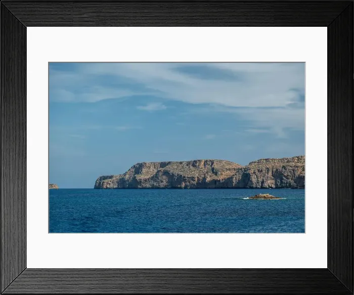 Framed Print : A scenic coastal view of the rugged cliffs along the coastline of Gramvousa Framed Print : A scenic coastal view of the rugged cliffs along the coastline of Gramvousa