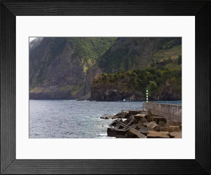 Framed Print : Coastline with big cliffs of Seixal and the Port with the Veu da Noiva waterfall in the background Framed Print : Coastline with big cliffs of Seixal and the Port with the Veu da Noiva waterfall in the background