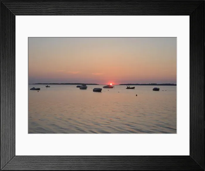 Framed Print : Sunset with red sun over the german Salzhaff at the baltic sea, view to somes boat silhouettes Framed Print : Sunset with red sun over the german Salzhaff at the baltic sea, view to somes boat silhouettes