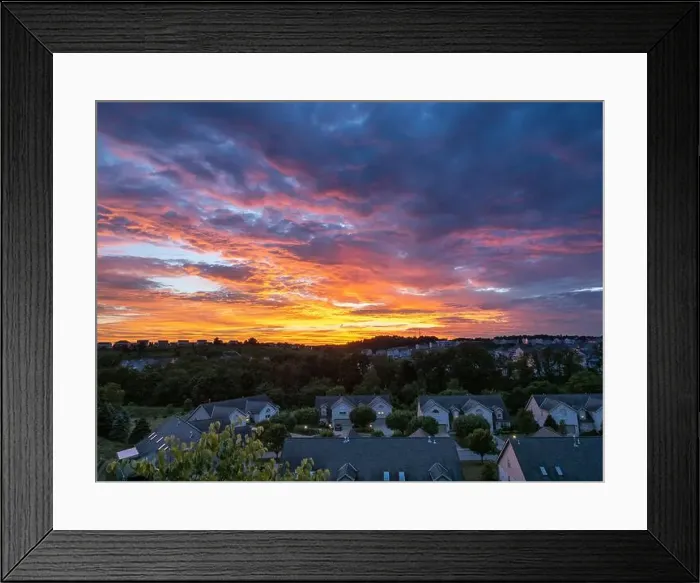 Framed Print : A breathtakingly colorful sunset lights up the summer sky Framed Print : A breathtakingly colorful sunset lights up the summer sky