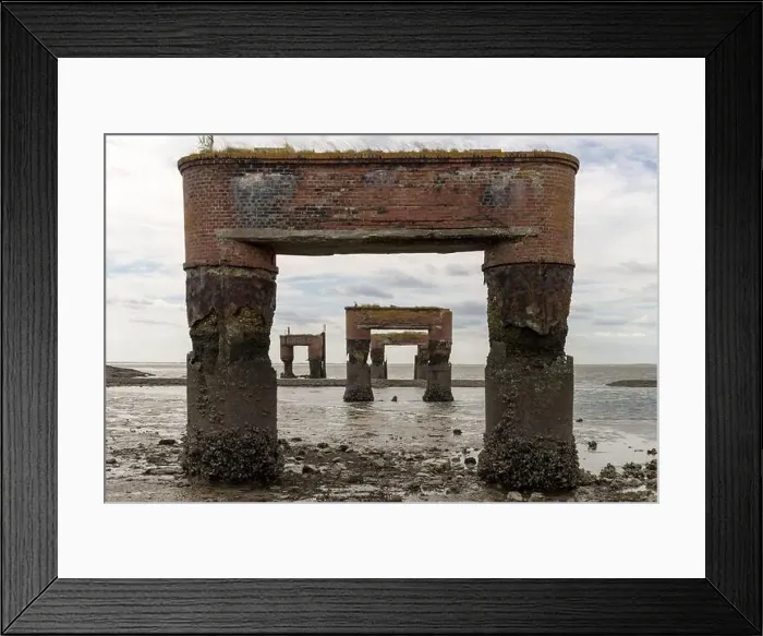 Framed Print : Abandoned ferry pier at Eckwarderhörne, Germany, showing rusted brick supports standing against the tides Framed Print : Abandoned ferry pier at Eckwarderhörne, Germany, showing rusted brick supports standing against the tides