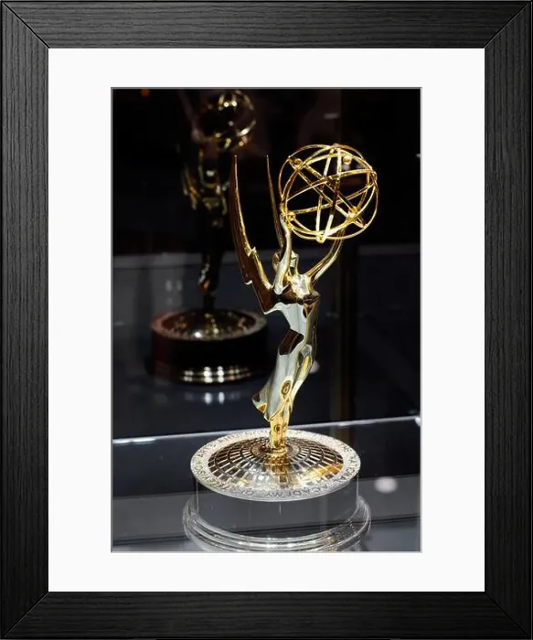 Framed Print : An Emmy award statuette in a display case. National Academy of Television Arts and Sciences trophy Framed Print : An Emmy award statuette in a display case. National Academy of Television Arts and Sciences trophy