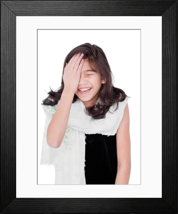 Framed Print : Young girl slapping herself on the head, laughing Framed Print : Young girl slapping herself on the head, laughing