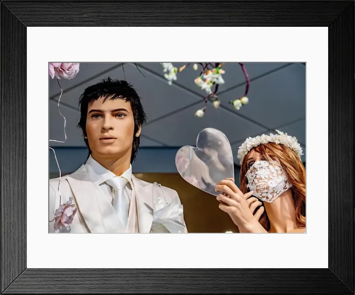 Framed Print : A view a male and female mannequins dressed in bridal wear with the female mannequin wearing a laced bridal facemask Framed Print : A view a male and female mannequins dressed in bridal wear with the female mannequin wearing a laced bridal facemask