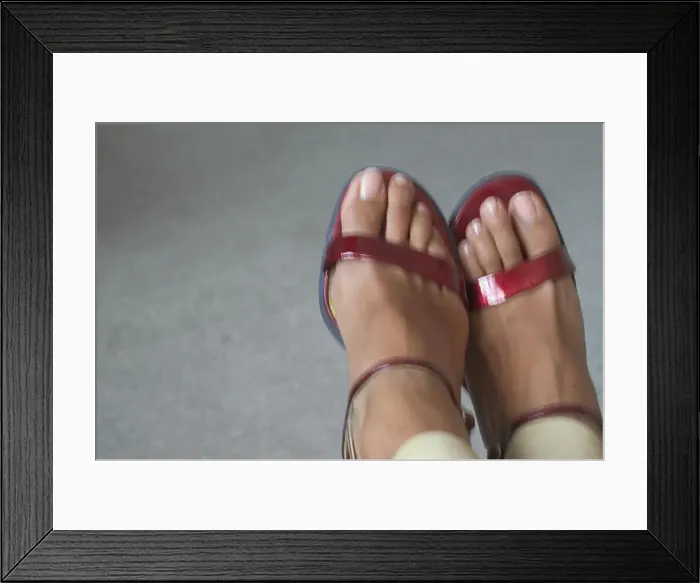 Framed Print : girl's feet in red strappy sandals Framed Print : girl's feet in red strappy sandals