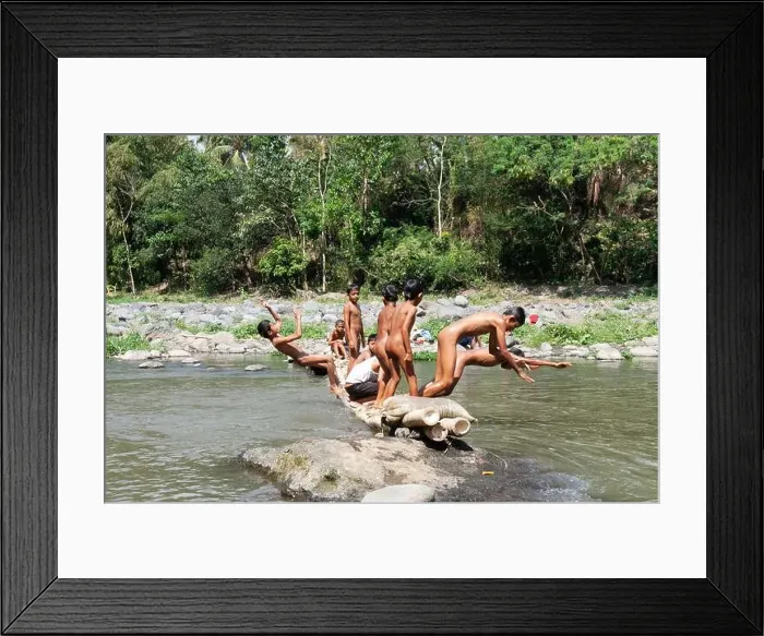 Framed Print : Residents in Taman Krocok village, Bondowoso, use the river for bathing and for playing Framed Print : Residents in Taman Krocok village, Bondowoso, use the river for bathing and for playing