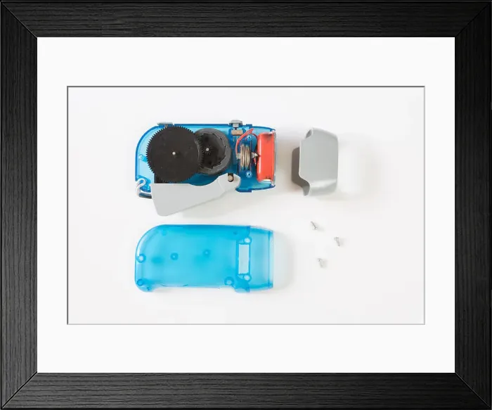 Framed Print : Interior of a dyno torch, dynamo wind up flashlight hand pressing crank Framed Print : Interior of a dyno torch, dynamo wind up flashlight hand pressing crank