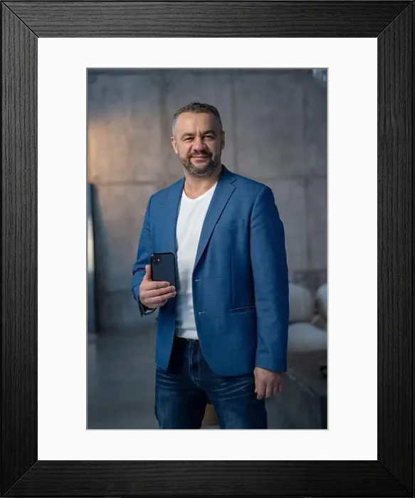Framed Print : Excited happy young indian man winner feeling joy using smartphone winning lottery game Framed Print : Excited happy young indian man winner feeling joy using smartphone winning lottery game