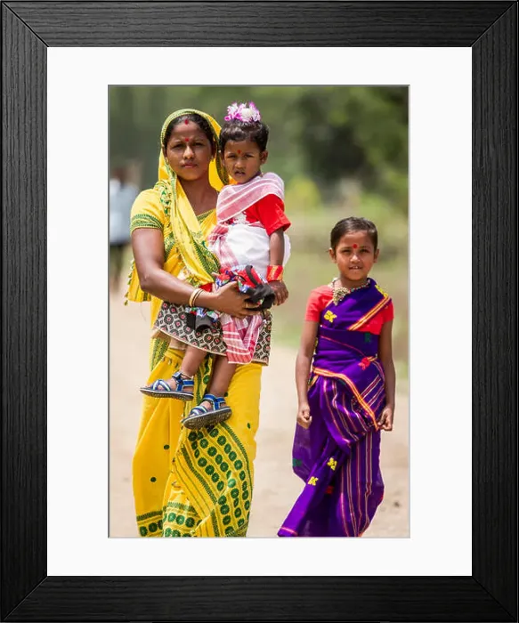 Framed Print : A family walks together in Pan Bari Village in the Kaziranga National Park in India on the 13th April 2016 Framed Print : A family walks together in Pan Bari Village in the Kaziranga National Park in India on the 13th April 2016