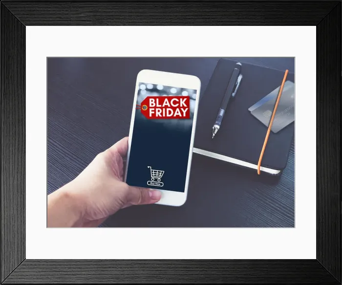 Framed Print : Black Friday sale tag with shopping cart on mobile screen Framed Print : Black Friday sale tag with shopping cart on mobile screen