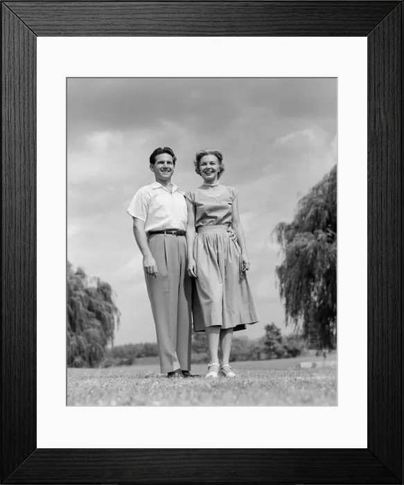 Framed Print : 1950s SMILING COUPLE STANDING ON LAWN LOOKING AT CAMERA Framed Print : 1950s SMILING COUPLE STANDING ON LAWN LOOKING AT CAMERA
