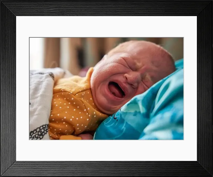 Framed Print : The facial expressions of a new born baby girl