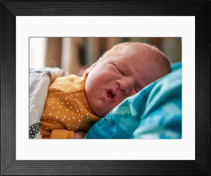 Framed Print : The facial expressions of a new born baby girl Framed Print : The facial expressions of a new born baby girl