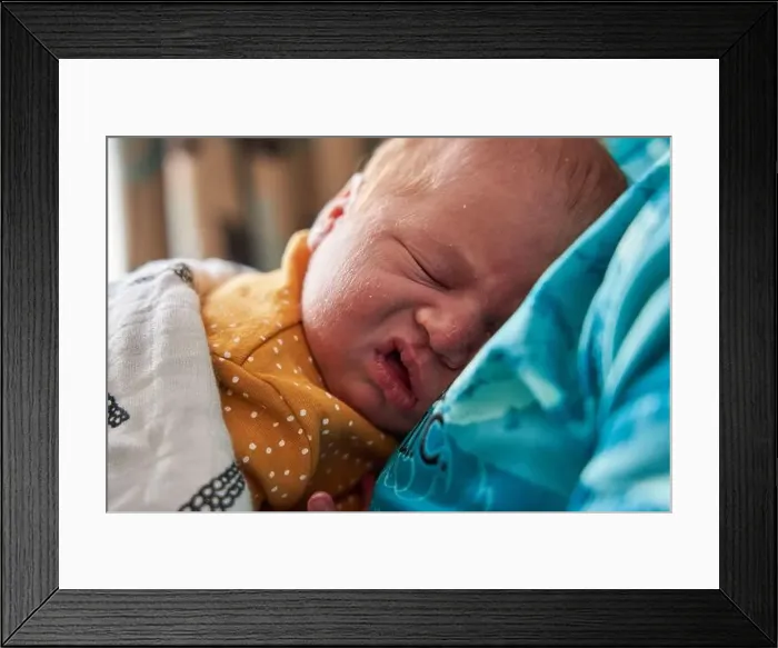 Framed Print : The facial expressions of a new born baby girl Framed Print : The facial expressions of a new born baby girl