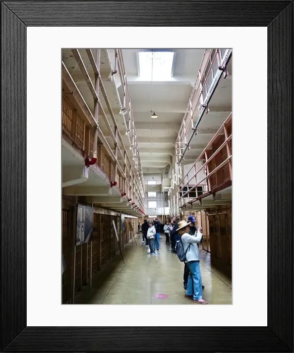 Framed Print : Tourists inside Alcatraz Federal penitentiary looking up at corridors with prison cells Alcatraz Island San Francisco Framed Print : Tourists inside Alcatraz Federal penitentiary looking up at corridors with prison cells Alcatraz Island San Francisco