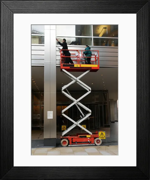 Framed Print : People on scissor lift cleaning City of London UK Framed Print : People on scissor lift cleaning City of London UK