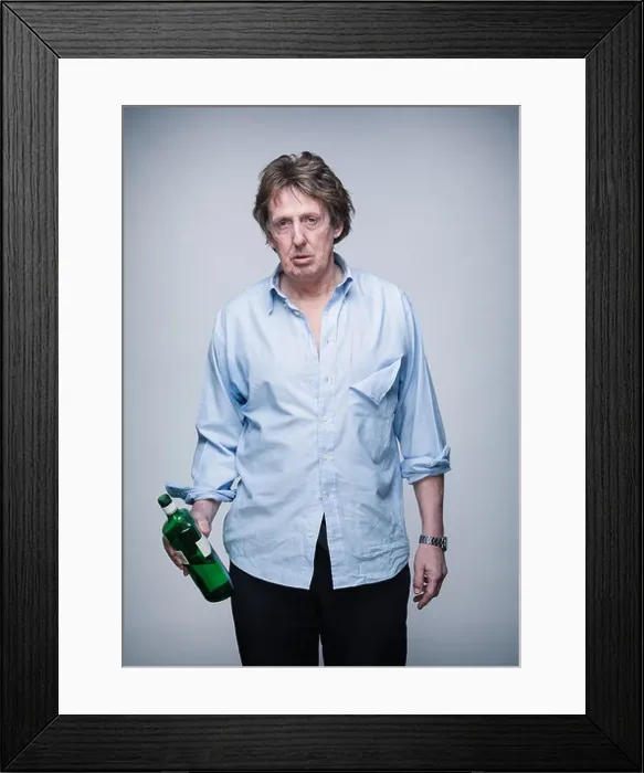 Framed Print : Alcoholic middle aged professional man following a fight, holding spirits bottle Framed Print : Alcoholic middle aged professional man following a fight, holding spirits bottle
