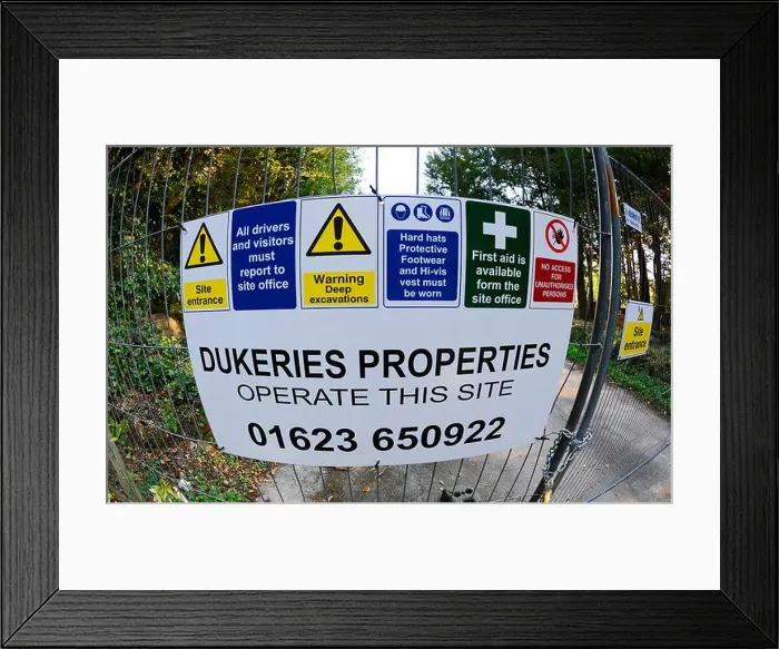 Framed Print : Construction warning and safety signs at the entrance to a construction site Framed Print : Construction warning and safety signs at the entrance to a construction site