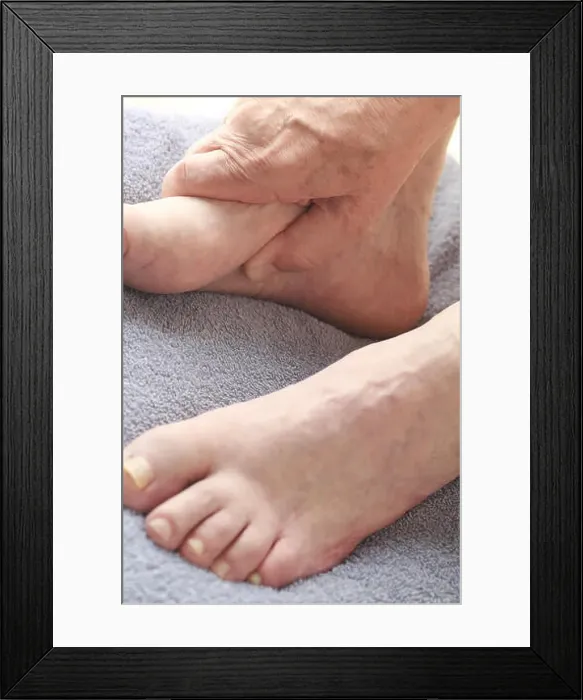 Framed Print : Older man with hand on foot Framed Print : Older man with hand on foot