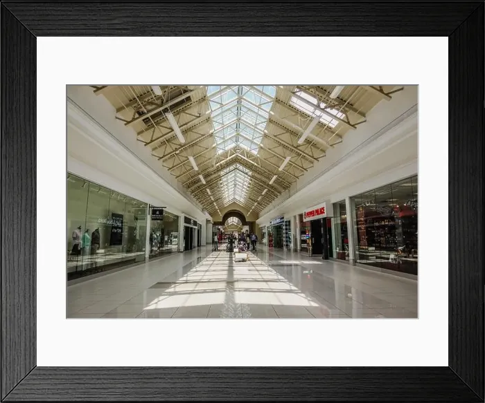 Framed Print : Fashion Outlets of Niagara Falls USA is a contemporary shopping mall with outlet stores from well-known retailers Framed Print : Fashion Outlets of Niagara Falls USA is a contemporary shopping mall with outlet stores from well-known retailers