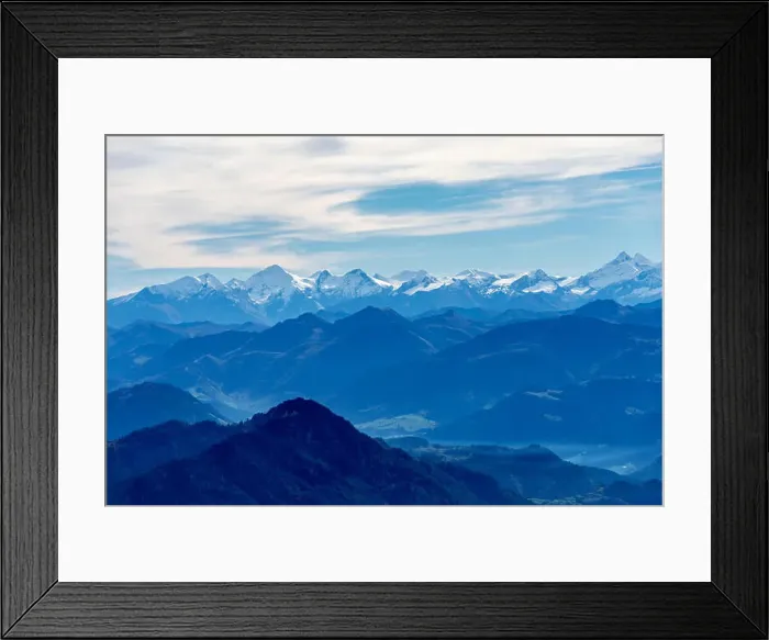 Framed Print : alps mountain range in blue appearance due to aerial perspective, covered with snow Framed Print : alps mountain range in blue appearance due to aerial perspective, covered with snow