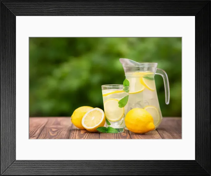 Framed Print : lemonade in glass and jug on wooden table outdoors. Summer refreshing drink. Cold detox water with lemon Framed Print : lemonade in glass and jug on wooden table outdoors. Summer refreshing drink. Cold detox water with lemon