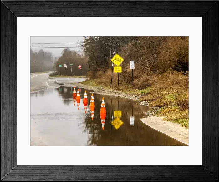 Framed Print : line of orange traffic cones in a water puddle Framed Print : line of orange traffic cones in a water puddle