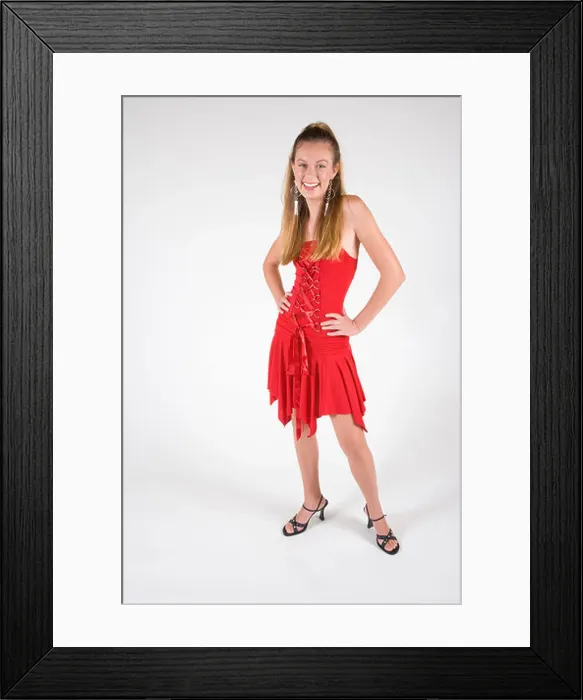 Framed Print : Portrait of young stylish woman in red dress, studio shot Framed Print : Portrait of young stylish woman in red dress, studio shot