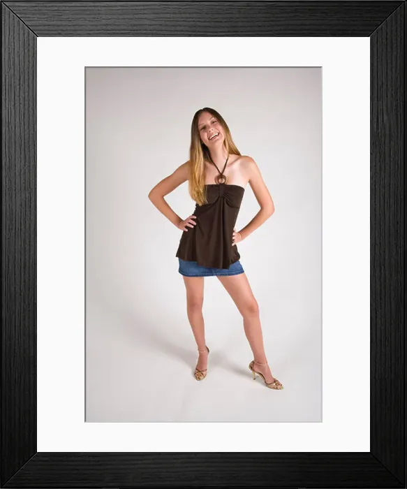 Framed Print : Portrait of young stylish woman, studio shot Framed Print : Portrait of young stylish woman, studio shot