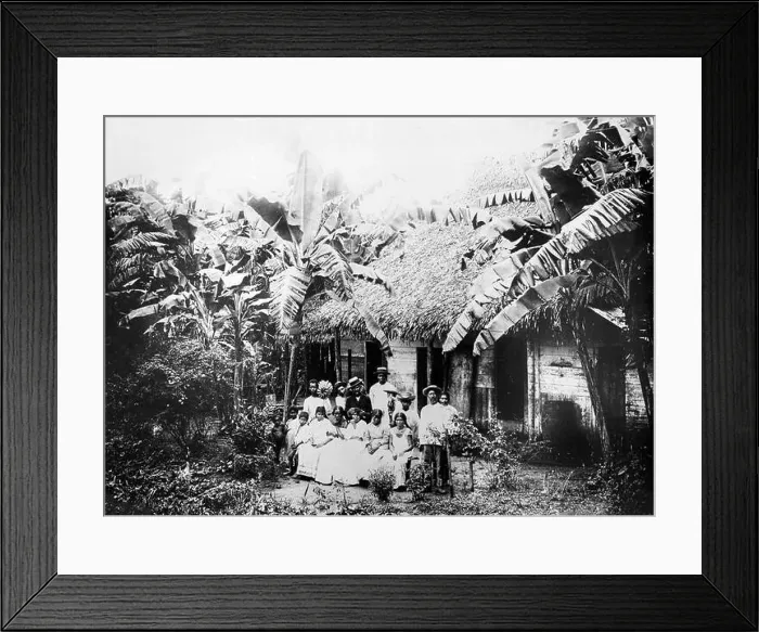 Framed Print : An early twentieth century black and white photograph showing a native family in Panama with their hut Framed Print : An early twentieth century black and white photograph showing a native family in Panama with their hut