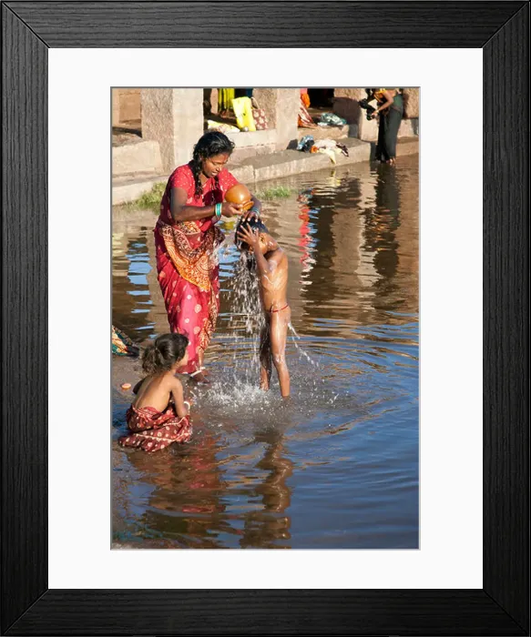 Framed Print : Mother washing her son. Tungabhadra river. Hampi. India