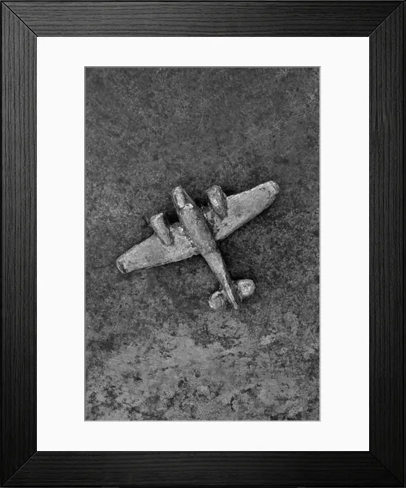 Framed Print : Monochrome image of vintage lead model airplane on tarnished metal Framed Print : Monochrome image of vintage lead model airplane on tarnished metal