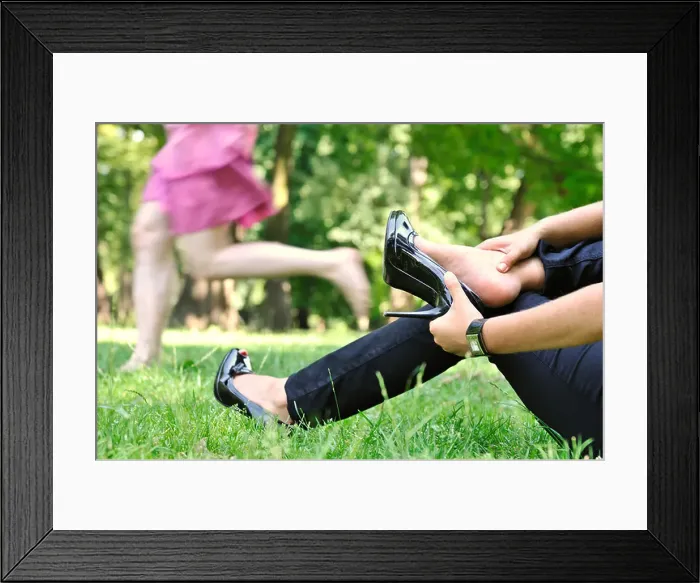 Framed Print : One woman running barefoot in park and second is taking her shoes off Framed Print : One woman running barefoot in park and second is taking her shoes off