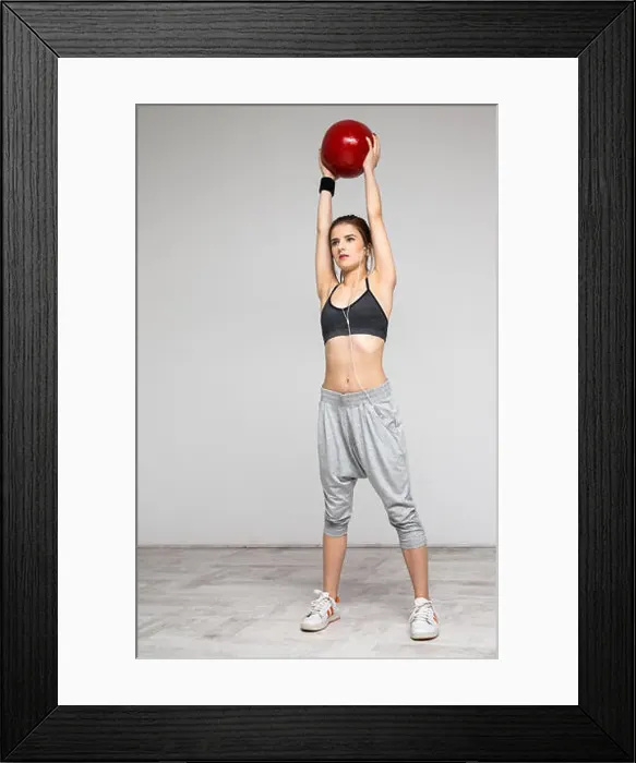 Framed Print : Attractive sports woman working out with a medicine ball Framed Print : Attractive sports woman working out with a medicine ball
