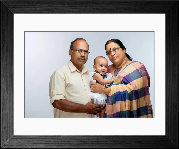 Framed Print : Happy Indian Family, grand parents and baby girl, isolated on white background Framed Print : Happy Indian Family, grand parents and baby girl, isolated on white background