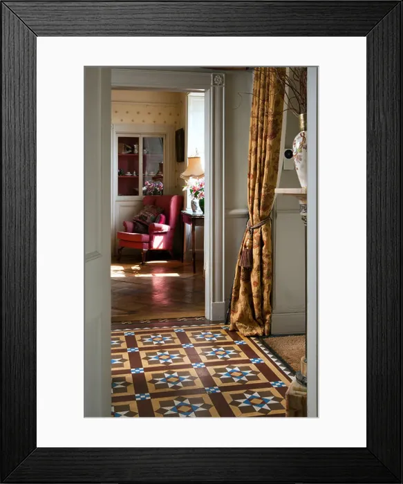 Framed Print : Decorative Victorian floor tiles in an entrance hall with drawing room glimpsed beyond Framed Print : Decorative Victorian floor tiles in an entrance hall with drawing room glimpsed beyond