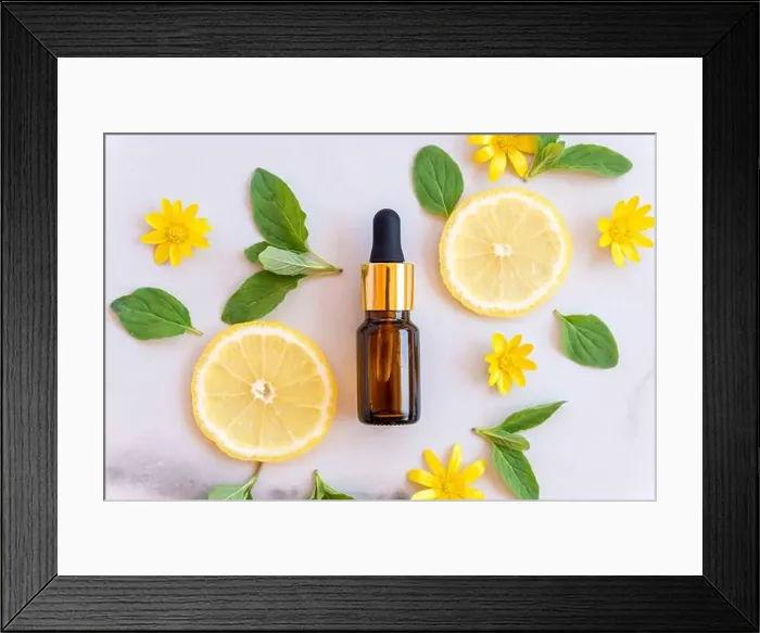 Framed Print : Vitamin C serum in cosmetic bottle with lemon citrus slices with green leaves on white background Framed Print : Vitamin C serum in cosmetic bottle with lemon citrus slices with green leaves on white background