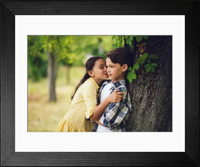 Framed Print : Little girl kissing boy Framed Print : Little girl kissing boy