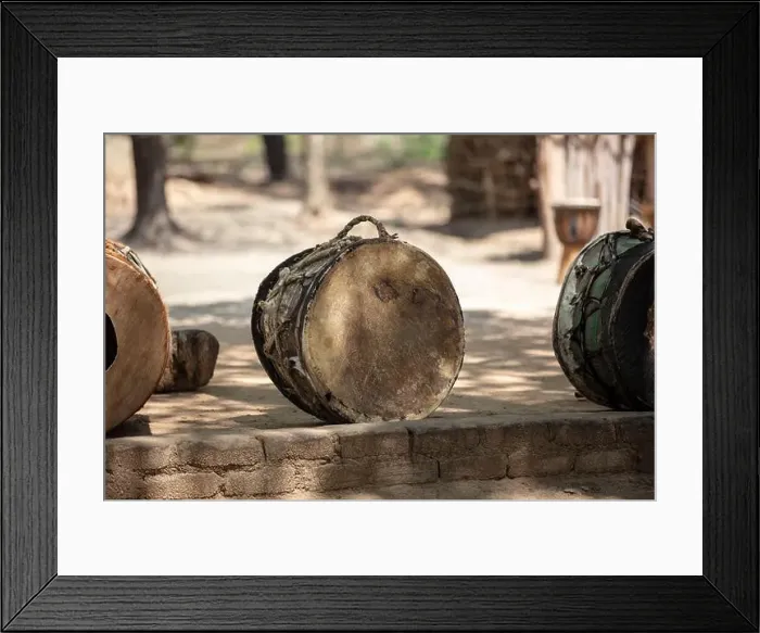 Framed Print : African drums, handmade traditional music instruments on the ground, outdoors. South Africa, Zululand Framed Print : African drums, handmade traditional music instruments on the ground, outdoors. South Africa, Zululand