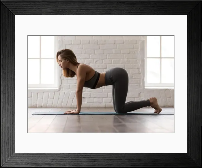Framed Print : Beautiful woman practicing yoga, standing in Cow pose, Bitilasana exercise Framed Print : Beautiful woman practicing yoga, standing in Cow pose, Bitilasana exercise