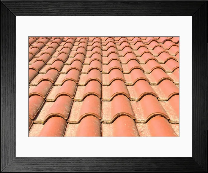 Framed Print : Terracotta roof tiles on the roof of a building Framed Print : Terracotta roof tiles on the roof of a building
