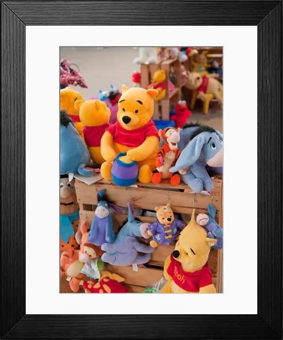 Framed Print : Winnie the Pooh toys for sale at a local market Framed Print : Winnie the Pooh toys for sale at a local market