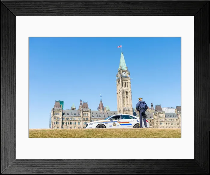 Framed Print : Ottawa, Canada - 15th April 2016: A RCMP police car is parked in front ot the Canadian Parliament in Ottawa Framed Print : Ottawa, Canada - 15th April 2016: A RCMP police car is parked in front ot the Canadian Parliament in Ottawa