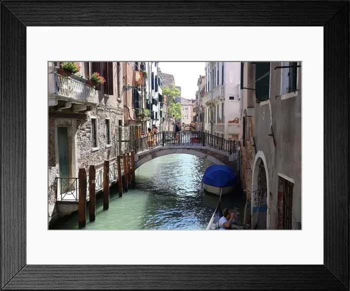 Framed Print : The Ponte dei Conzafelzi bridge in Venice with people walking through it during daytime Framed Print : The Ponte dei Conzafelzi bridge in Venice with people walking through it during daytime