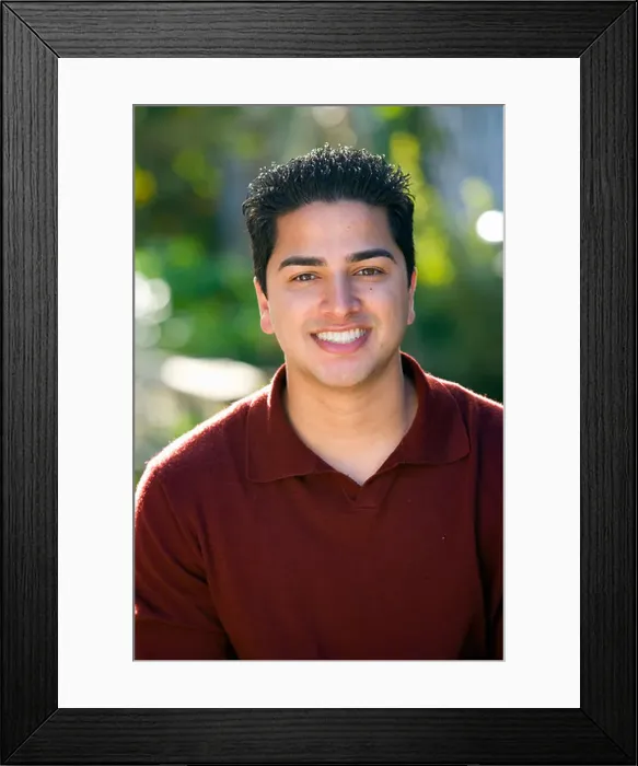 Framed Print : Portrait of 25 year old Indian man outside Framed Print : Portrait of 25 year old Indian man outside