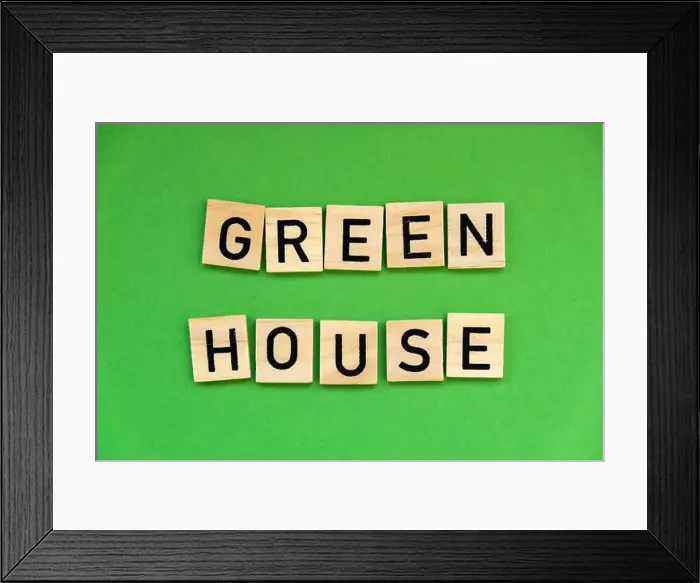 Framed Print : Green house text on wooden blocks on green background. Ecological concept Sustainable responsible living. Copy space Framed Print : Green house text on wooden blocks on green background. Ecological concept Sustainable responsible living. Copy space