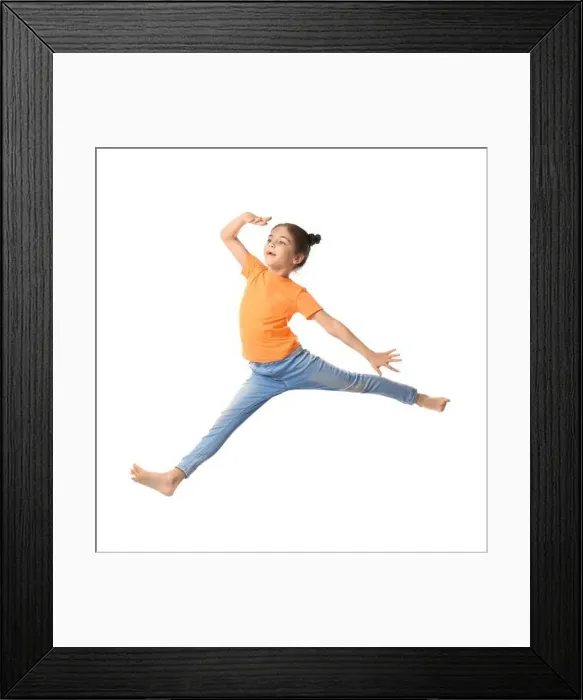 Framed Print : Cute little girl jumping on white background Framed Print : Cute little girl jumping on white background