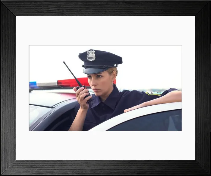 Framed Print : Serious police woman receiving call on radio set, emergency situation, rush Framed Print : Serious police woman receiving call on radio set, emergency situation, rush